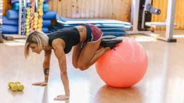 Woman Doing Pilates Exercises with a Ball