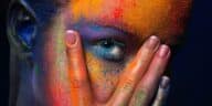 Model with colorful art make-up, close-up