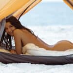 Naked Woman on the Beach in a Tent